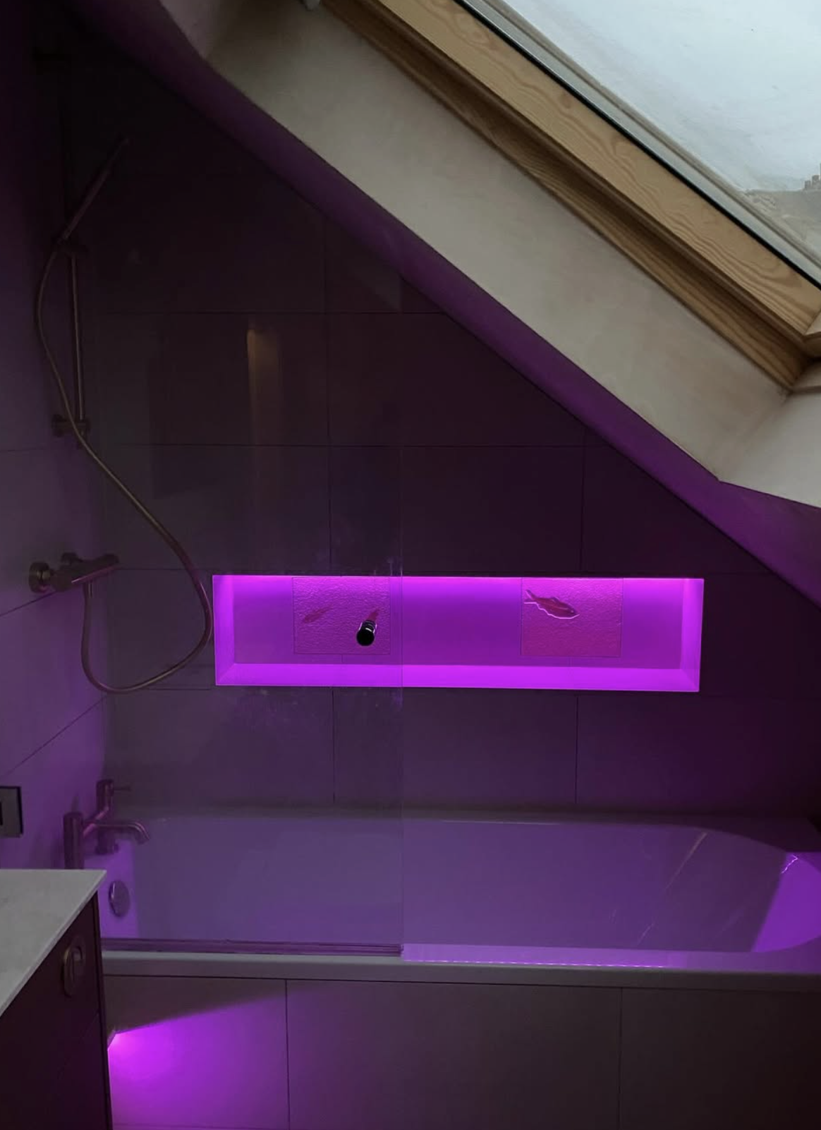 Bathroom with LED mood lighting and bath niche